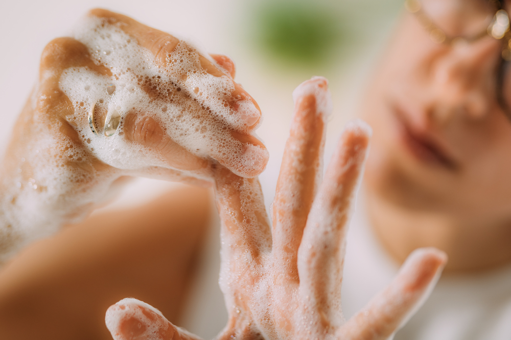 A Woman with OCD Washing Hands.