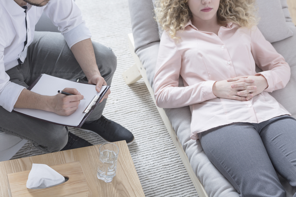 A woman with OCD disorder in a therapy session.