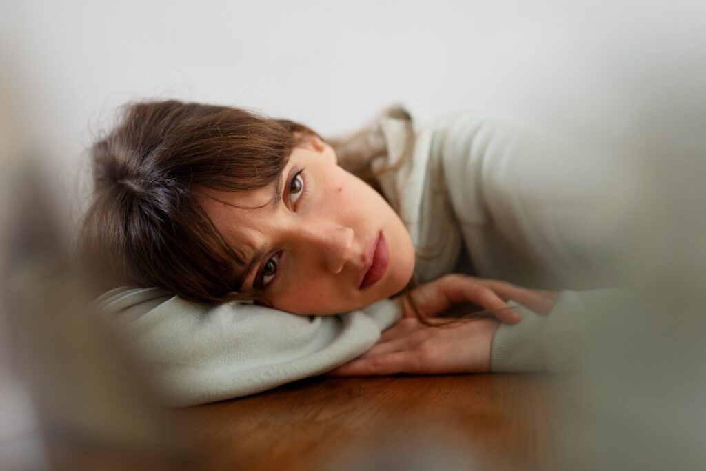 A young woman struggling with OCD and a tic disorder.