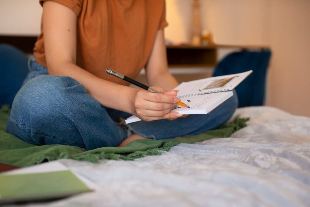 Woman using journaling as one of the ACT techniques for OCD.