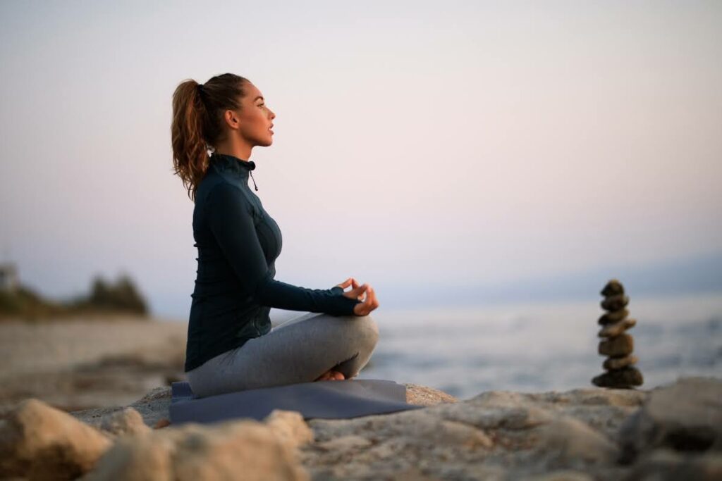 Woman practicing grounding as one of the ACT techniques for OCD.
